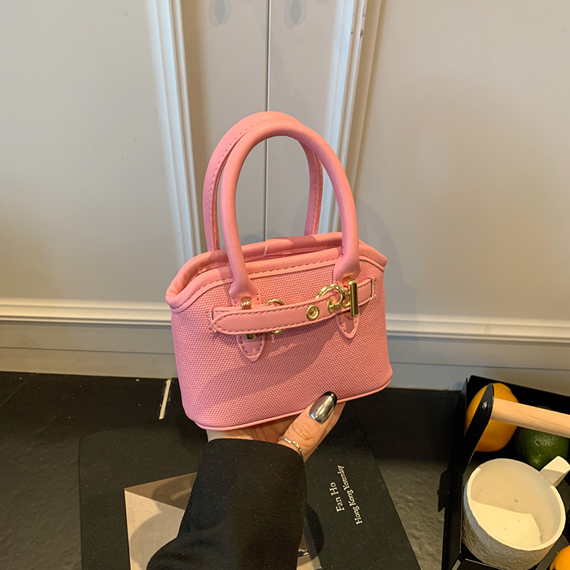 Bolsos de mano para niños lindos colgantes extranjeros mini bolsos de hombro para niños y niñas de color sólido simple bolsos de conchas de niños de moda