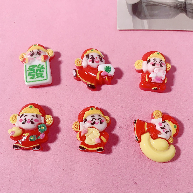 Año Nuevo dibujos animados dios de la fortuna Yuanbao accesorios de resina agujero zapatos caja de teléfono celular crema pegamento DIY automóvil control central dios de la fortuna