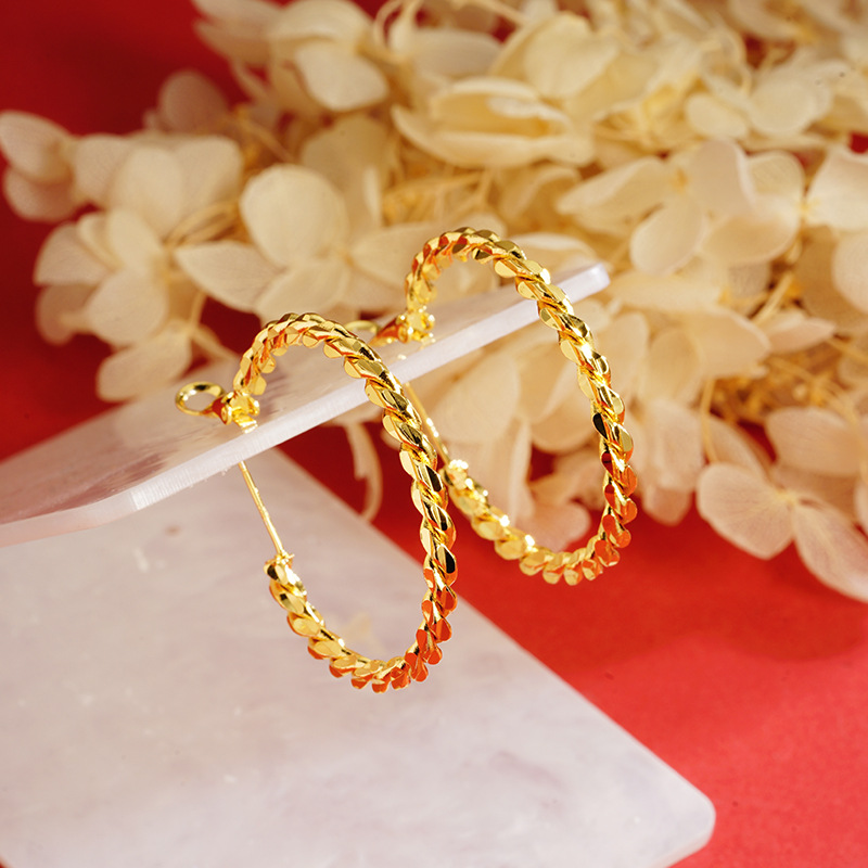 Productos calientes suministro de fábrica pendientes al por mayor Vietnam oro giro personalizado pendientes femeninos accesorios de estilo chino todo partido transmisión en vivo