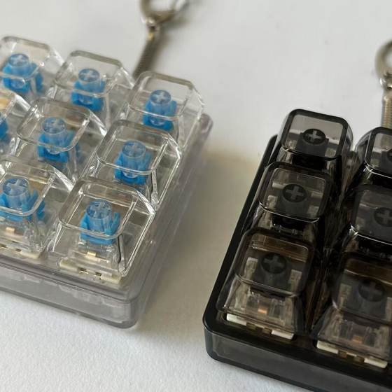 Foreign trade test shaft nine-key key decompression toy key chain pendant fingertip press can add lamp toy fingertip press