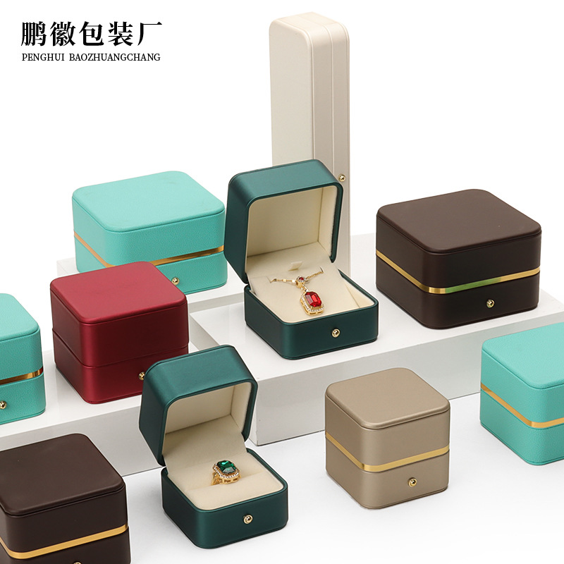 Caja de joyería de cuero de PU de borde dorado redondeado al por mayor caja de regalo de joyería de gama alta caja de reloj caja de joyería colgante de anillo
