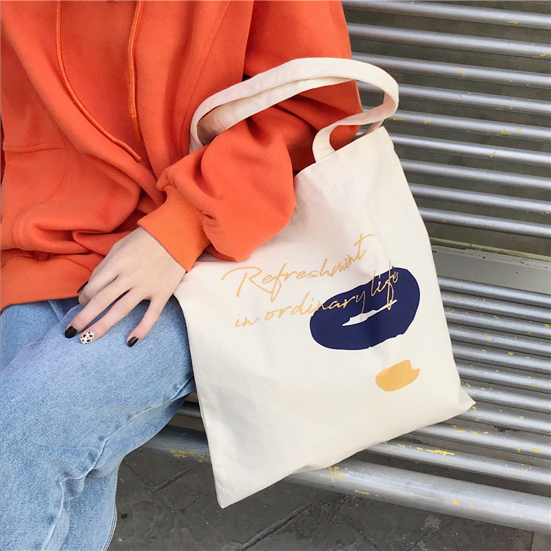 E131 canvas bag, Korean-style ins hand-held shoulder bag, color block letter graffiti shopping bag, female student's search for sources undefined