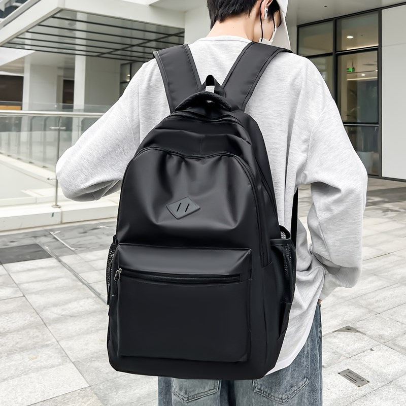 Moda al por mayor mochila de tela de Oxford nueva mochila simple de gran capacidad para estudiantes de secundaria mochila comercial USB