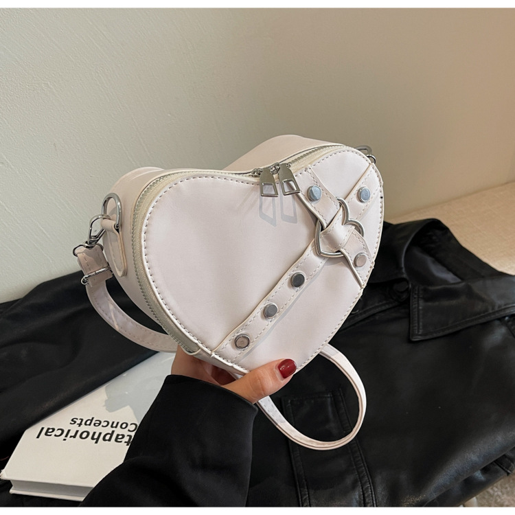 Internet celebridad personalizada de moda del todo-fósforo de color sólido en forma de corazón bolsa de costura bolsa de las mujeres nicho diseño crossbody hombro bolsa de las axilas