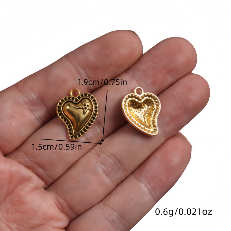 Transfronterizos 10 estilos de oro antiguo colorado colgante de aleación del corazón sagrado DIY encanto joyería accesorios metálicos