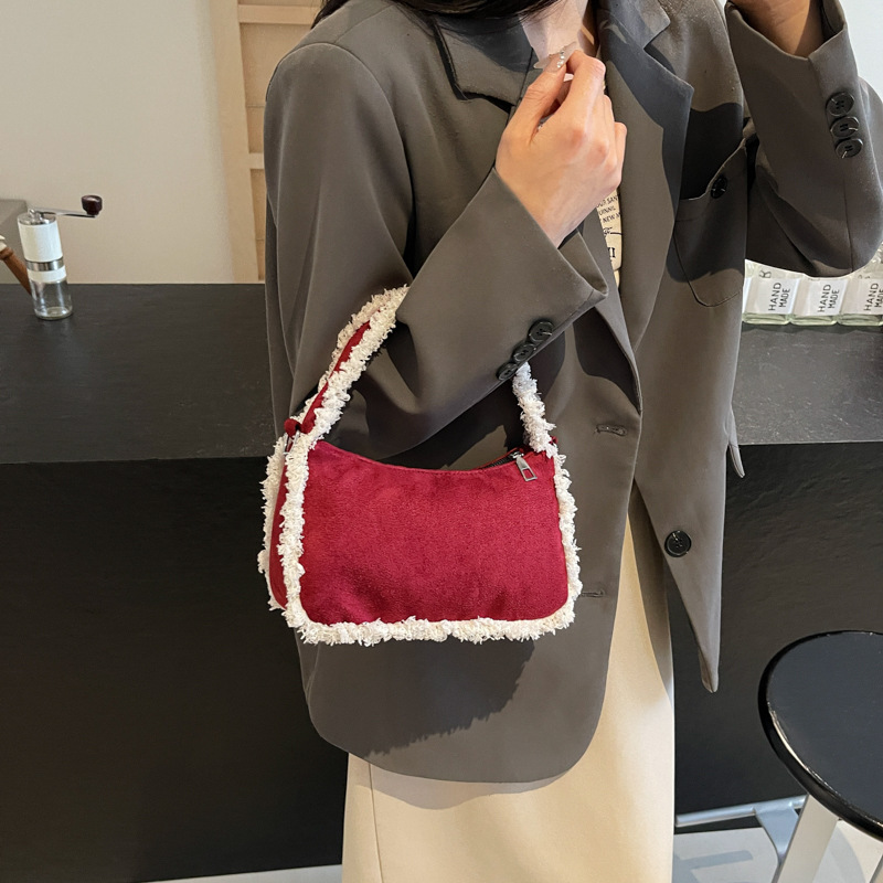 2024 otoño y invierno nueva moda de lana de cordero de alta capacidad bolso de hombro de moda empalme bolso de brazo bolso de lana bolso de mujer