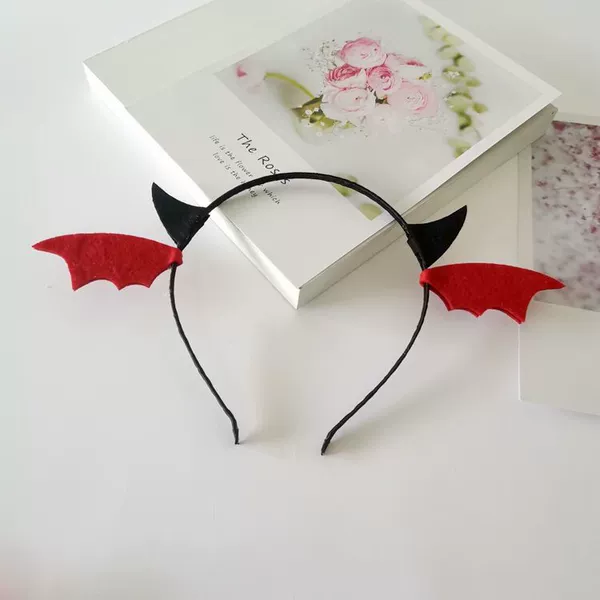 A headband with black horns and red wings