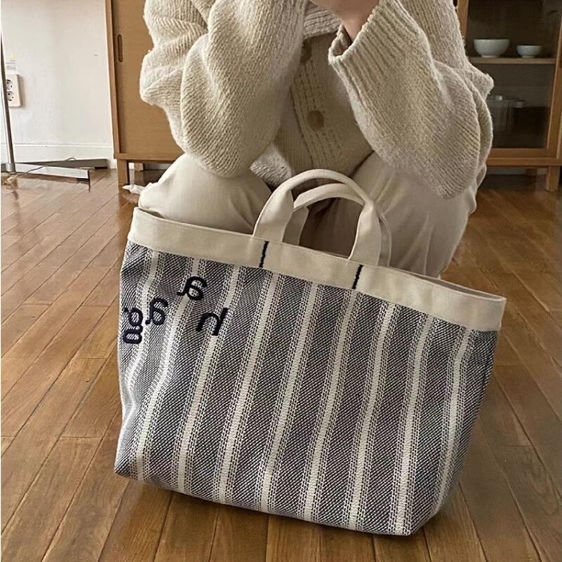 Korean designer brand haag's same style handbag, 2026 new trendy casual simple embroidered letter canvas bag Korean designer brand haag's same style handbag, 2026 new trendy casual simple embroidered letter canvas bag