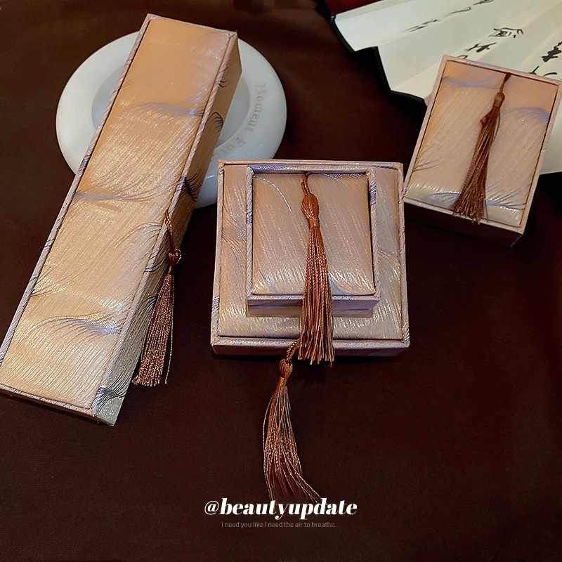 Joyería pluma borla anillo COLLAR COLGANTE pulsera caja de joyería Corea del Sur simple caja de polvo caja portátil