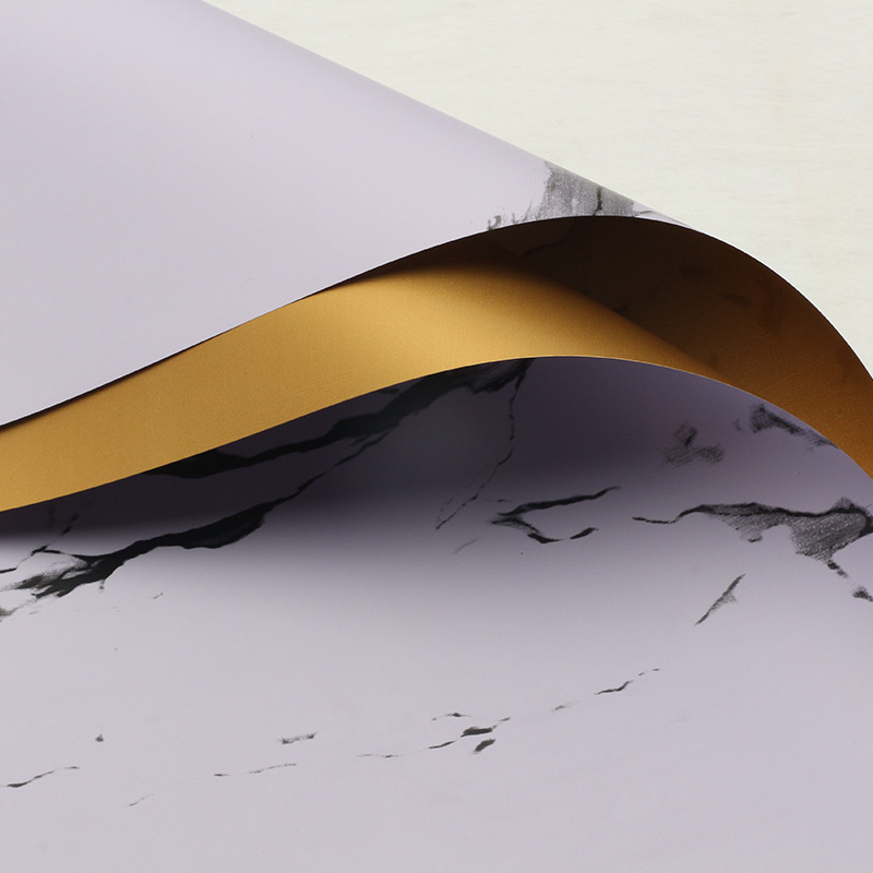 Huaxi comercio exterior transfronterizo mayorista oro lujo papel impermeable mármol oro papel de flor florista papel de embalaje