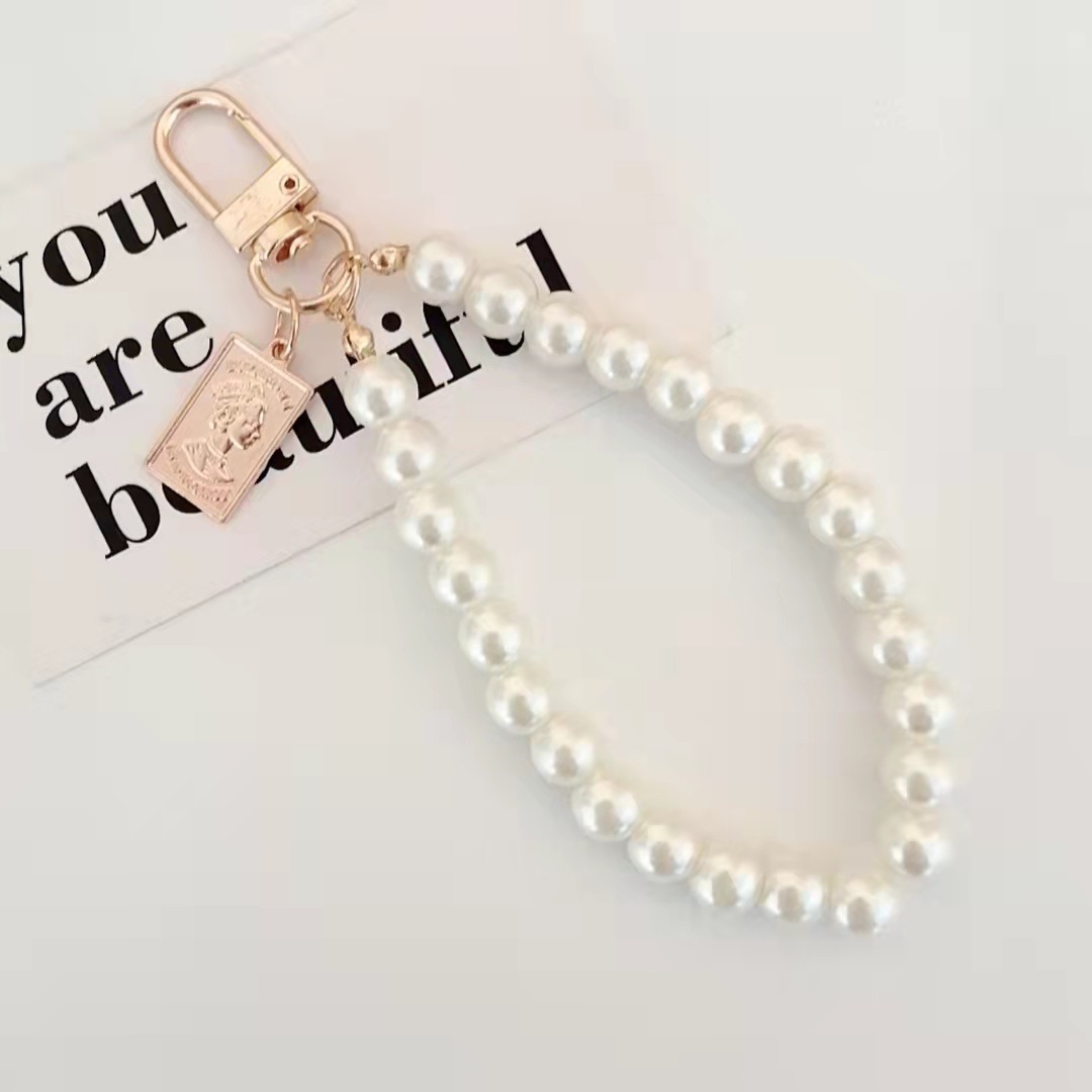 Japón y Corea del Sur color ins hecho a mano con cuentas flor llavero cordón de muñeca macaron color pétalo cordón de teléfono móvil en stock