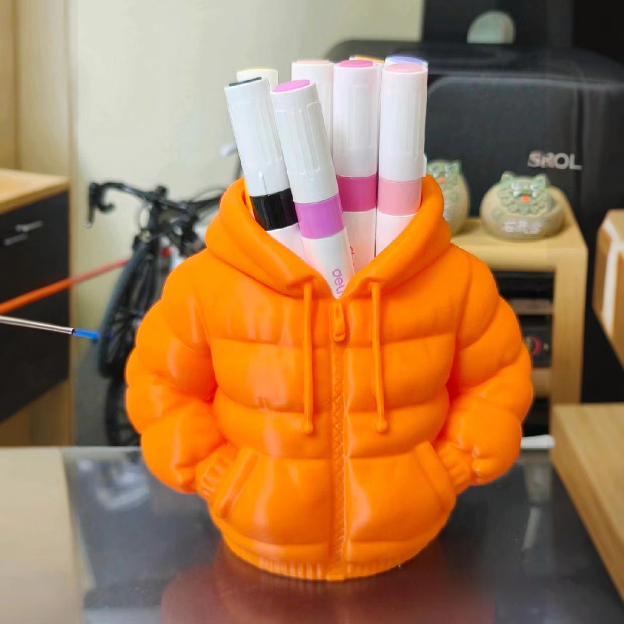 Orange down jacket, pens holder