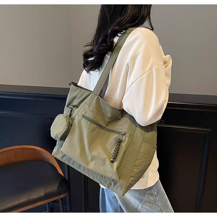 Transfronterizos casuales de color sólido nylon bolso de mano nueva bolsa de tela de transporte de gran capacidad simple y ligera mochila de hombro