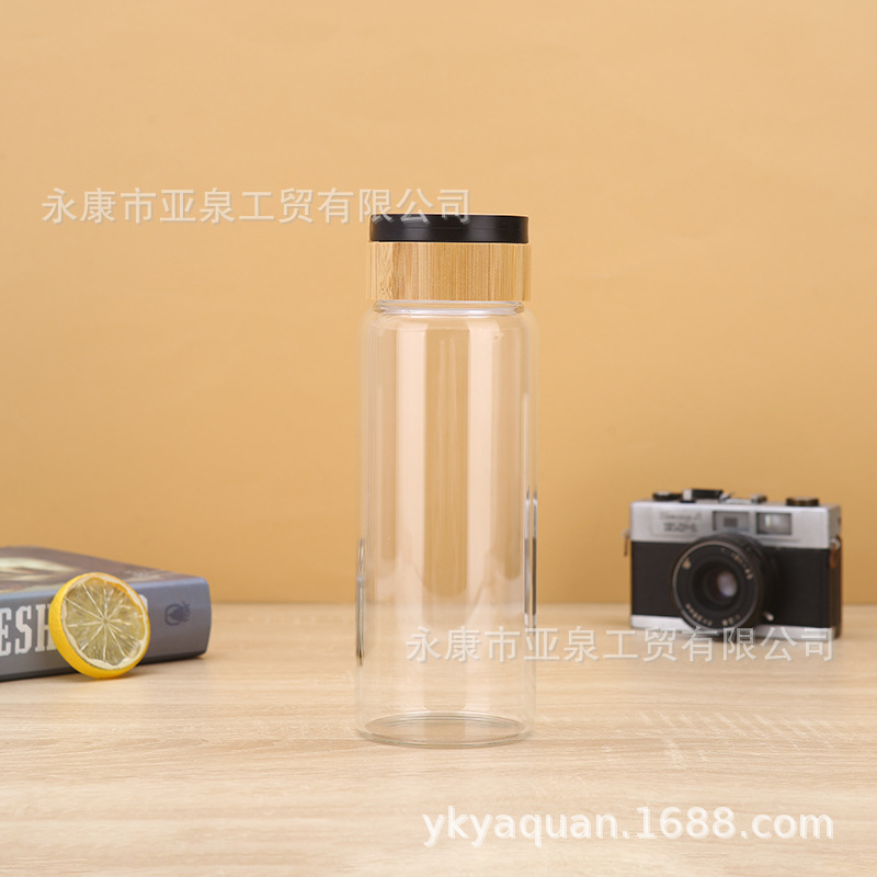 Fabricantes de suministro de copas de bambú portátiles de vidrio transparente aislamiento térmico taza de agua de oficina acompañante taza de regalo se puede imprimir logotipo