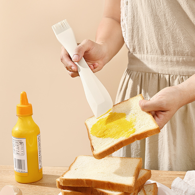 Nuevo tipo integral de cepillo de silicona de doble propósito raspador de silicona de grado alimenticio raspador de crema de cocina herramienta de limpieza