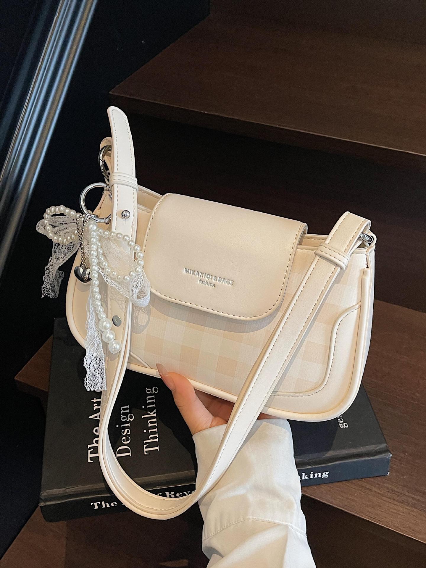 Bolso de axila de diseño de nicho a cuadros de estilo occidental 2025 nuevo bolso de hombro de todo fósforo de color en contraste bolso de mensajero de moda de alta gama