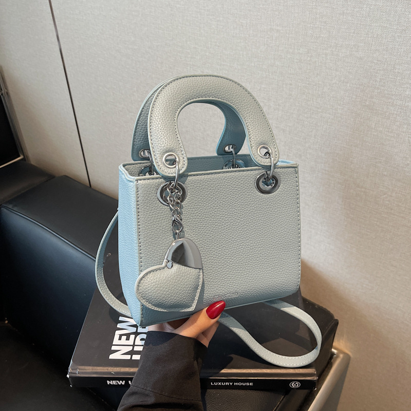 Bolso de mano de alta gama de comercio exterior para mujer 2025 nuevo bolso de hombro de todo fósforo de nicho de estilo occidental bolso de mensajero de moda