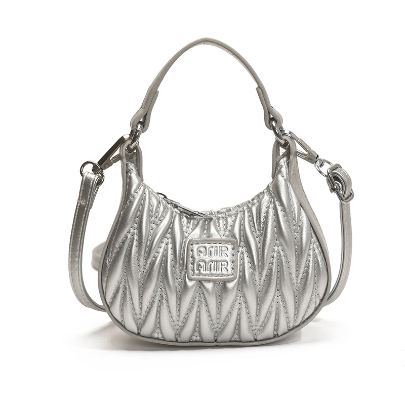 Versión coreana del bolso de hombro de niña de color sólido simple estilo occidental mini bolso de la axila portátil del bebé nuevo bolso de los niños plisado