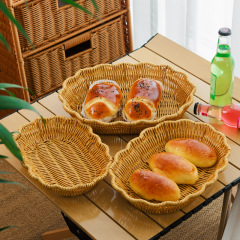 スナックの果物かごの果物皿の水たまりかごは藤編みの果物のたらいの軽い贅沢な風の家庭用の客間をまねて皿のキャンディーの皿を置きます。