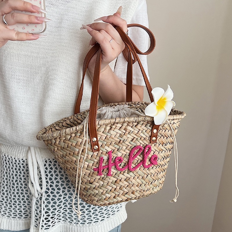 Bolso de verano para mujer, bolso versátil 2025, bolso de hombro de paja tejido sencillo para vacaciones, nuevo estilo.