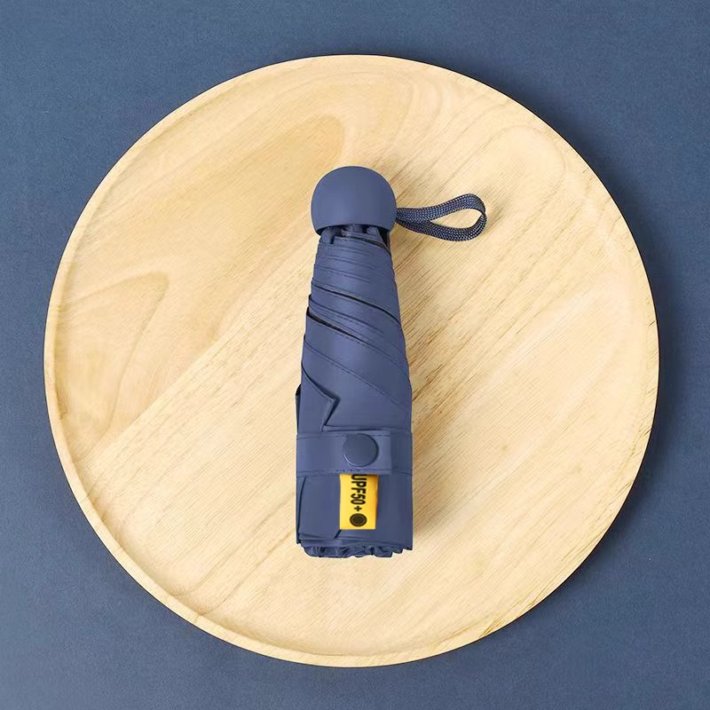 50% de descuento sol y lluvia paraguas de protección solar paraguas de sol UV portátil compacta cápsula sombrilla personalizada