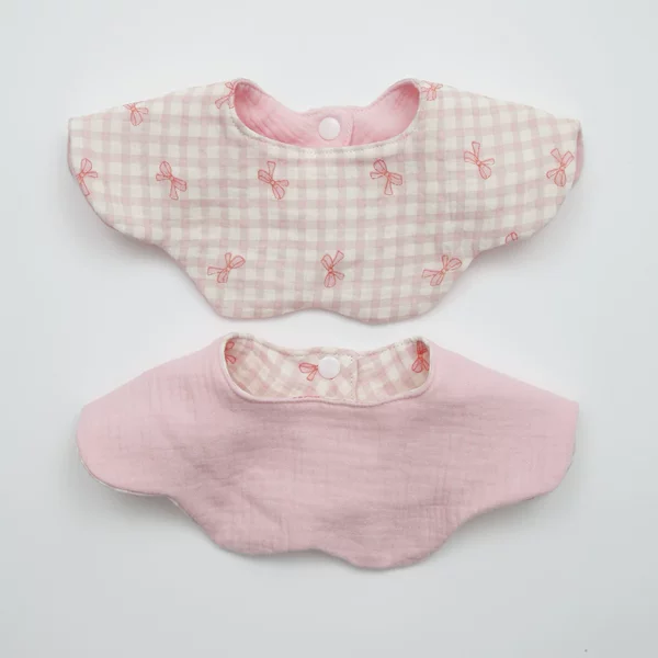 Double-sided fuchsia eating bib with bow