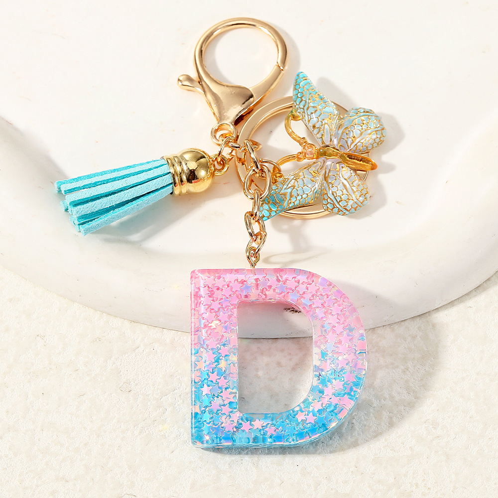 Europa y los Estados Unidos transfronterizos nuevos cristal sequinado goteo de goma letras inglesas joyería llavero y bolsos colgante apoyo al por mayor