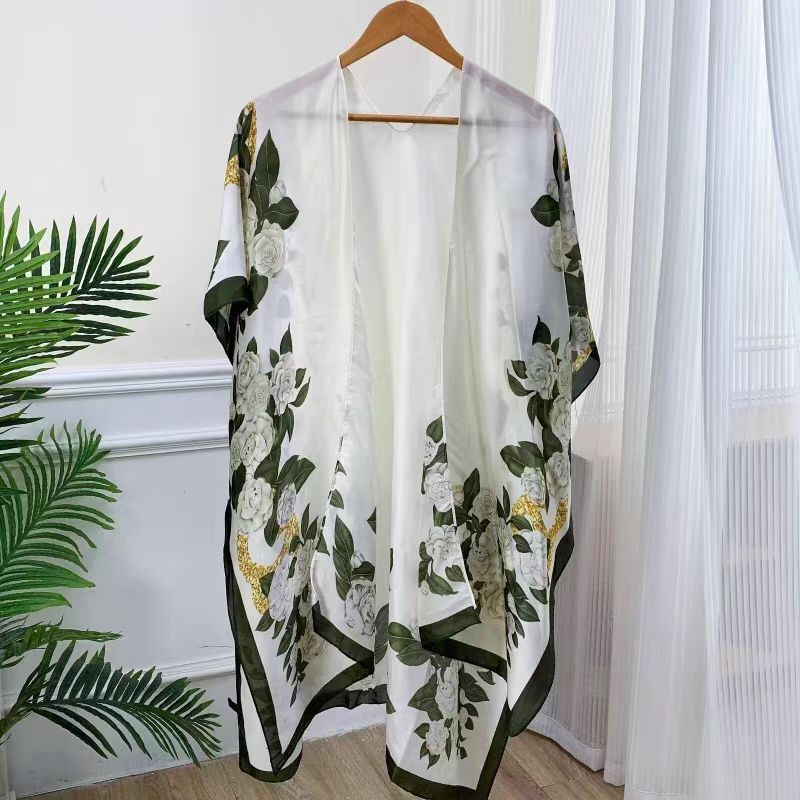 Chal de protección solar de verano para mujer 2025 nuevo estilo hebilla largo estilo étnico fotografía de viaje estilo fino playa bufanda de seda capa