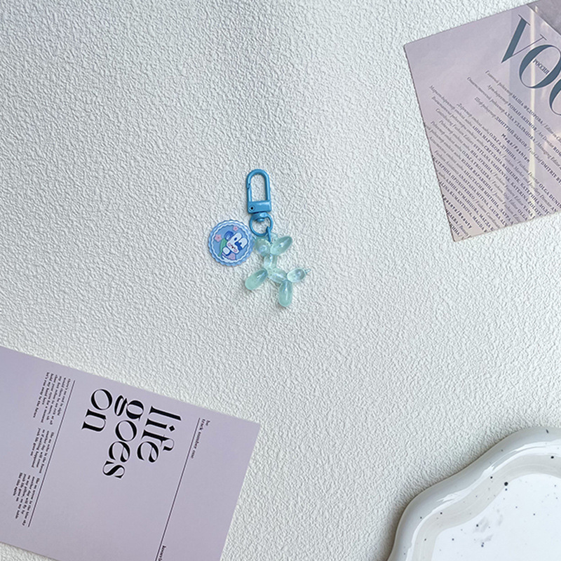 Pequeño Libro Rojo mismo lindo jalea globo láser perro llavero colgante colorido cachorro de dibujos animados teléfono llavero