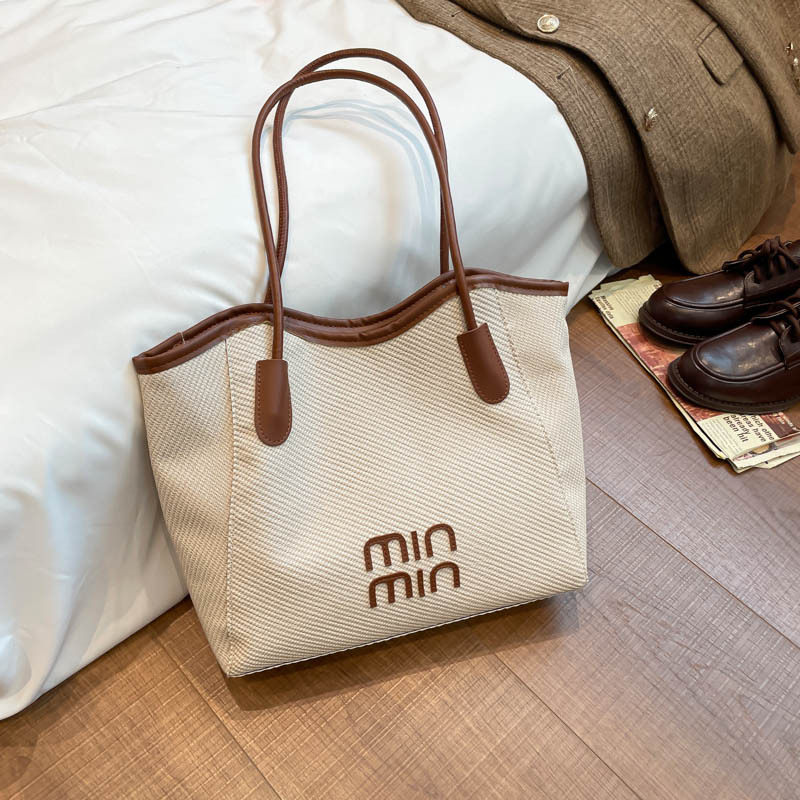 Nuevo tipo transfronterizo de gran capacidad de moda retro versátil de alto valor de la cara bolsas de hombro bolsas especiales para estudiantes universitarios
