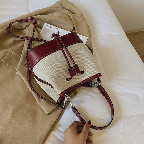 Wholesale women's bags autumn new European and American fashion bags crossbody bag drawstring stitching canvas portable bucket bag