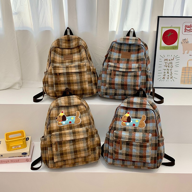 Mochila versión coreana de la versión coreana de la cuadrícula cuadrada de gran capacidad, mochilas escolares para estudiantes de secundaria y secundaria son simples y completas con paquetes de viaje de corta distancia.