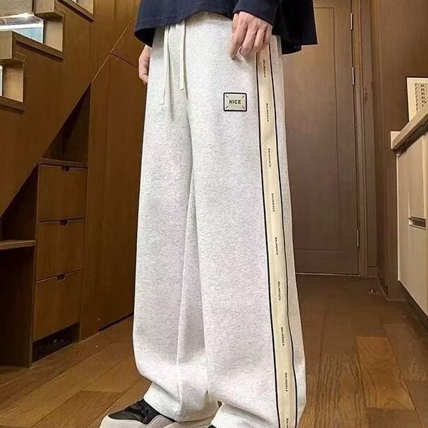 Pantalones casuales de hombre, tendencia de otoño y invierno, pantalones rectos de tamaño grande, pantalones deportivos elásticos de cintura delgada y caída.