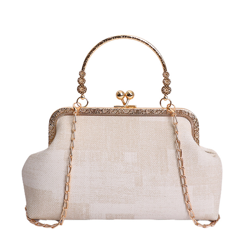 2026 nuevo pequeño viento de cadena bolsa de cena de mujeres de alto nivel sensación abrazadera bolso de mano mochila de estilo de moda bolsa de conchas