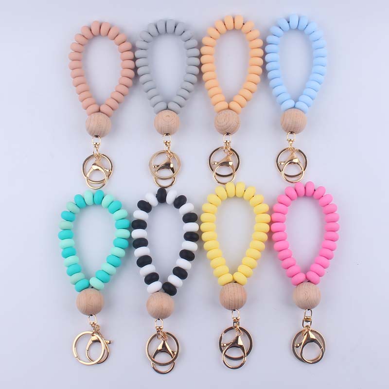 Korean Style Solid Color Wood Silica Gel Metal Beaded Unisex Keychain display picture 1