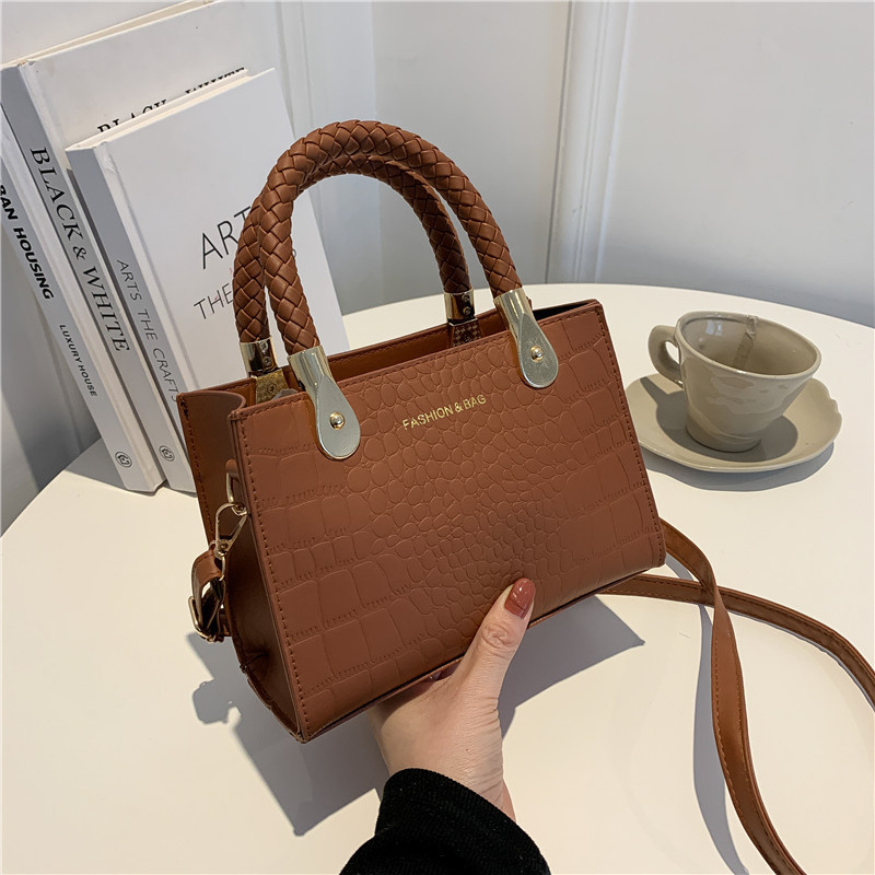 Bolsa de moda con textura para mujer 2024 estilo coreano estilo occidental nuevo color caramelo patrón de piedra bolso tejido bolsa de mensajero