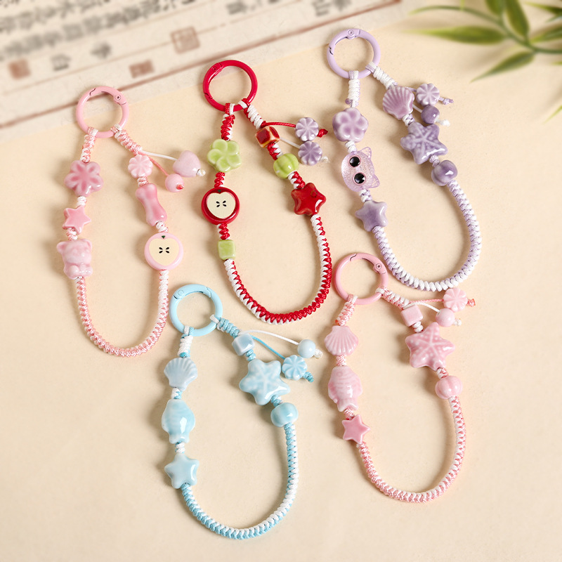 Small, fresh, and colorful starfish-themed braided phone straps, suitable for use as bag charms, car keychains, or headphone case decorations