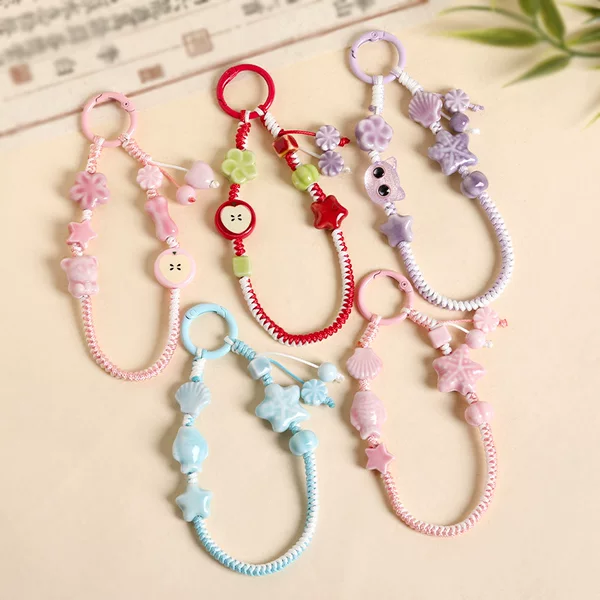 Small, fresh, and colorful starfish-themed braided phone straps, suitable for use as bag charms, car keychains, or headphone case decorations