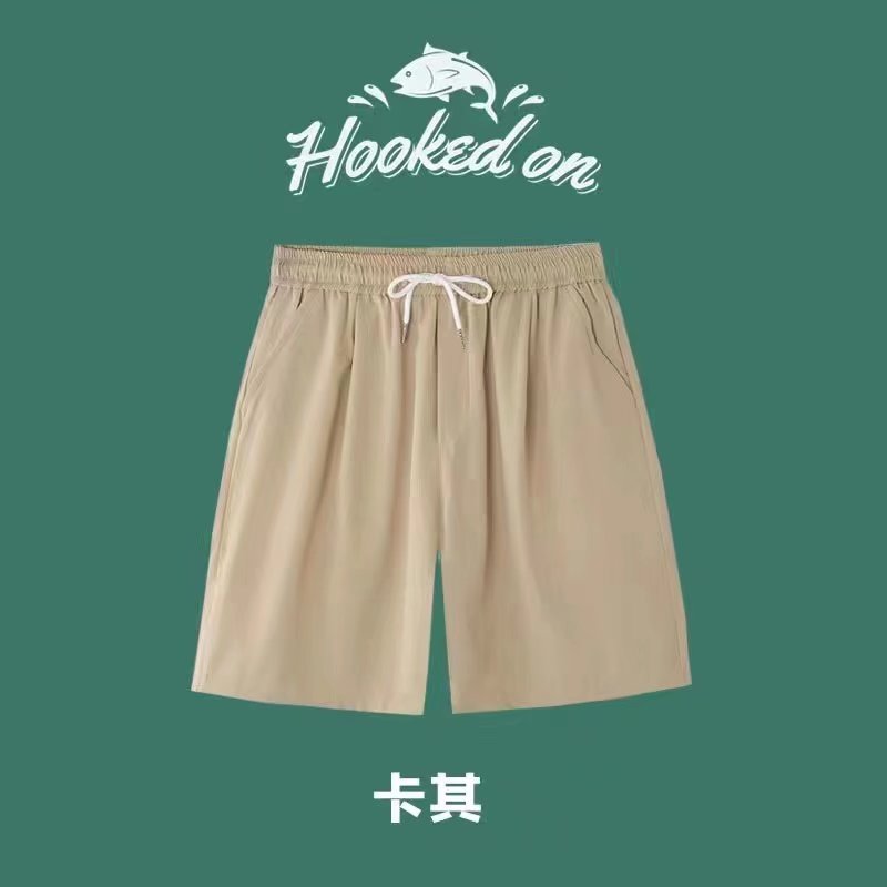 Pantalones cortos de playa de cinco puntos de verano pantalones grandes ropa exterior suelta color sólido ocio en casa pantalones cortos de flores moda en casa hombres