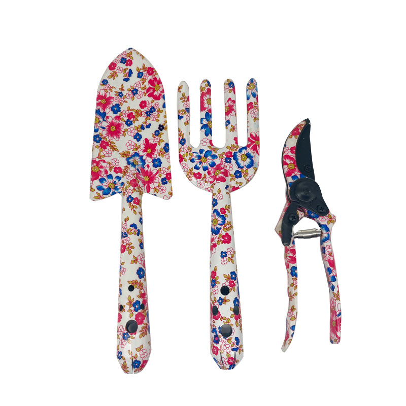 Herramientas al aire libre textura de impresión de flores pequeñas herramientas de jardín conjunto de tres piezas de impresión pala jardín flores y plantas herramientas de jardinería