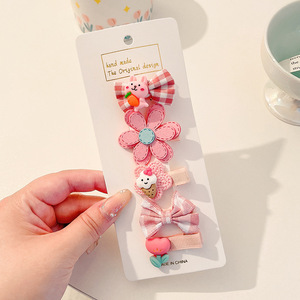 Hermosos clips de cabello de color para niños coreanos de alto nivel sensación de arco de niñas bolsa de tela no daña clips de cabello de bebé