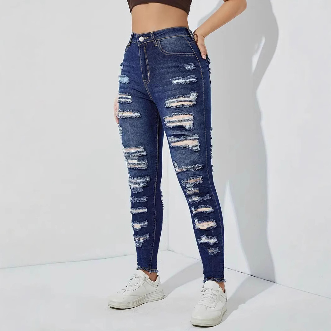Pantalones de mezclilla de mujer elásticos con bordes sin bordes rotos europeos y americanos transfronterizos