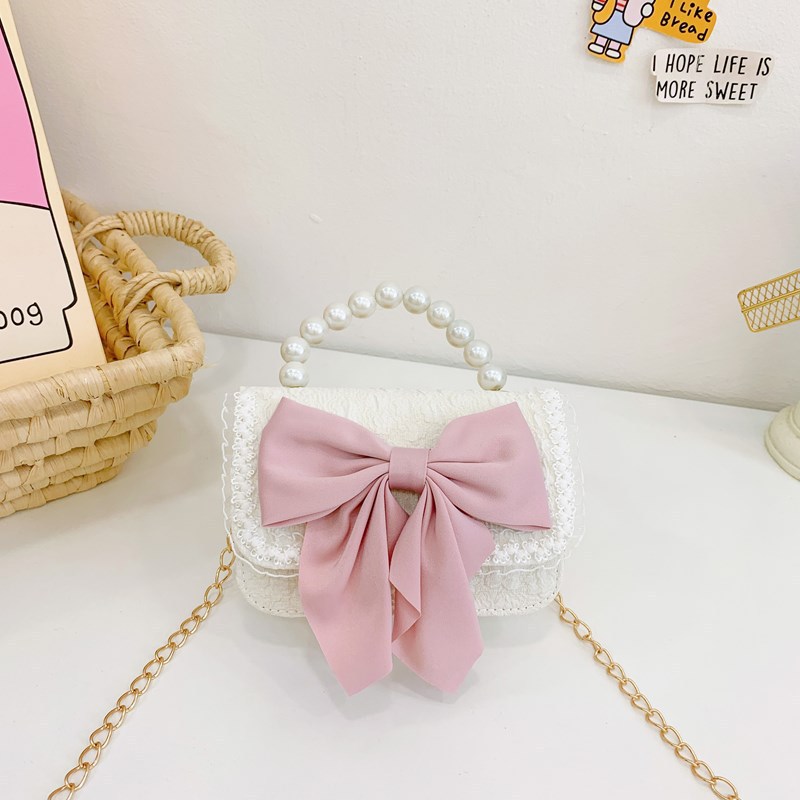 Otoño y invierno coreano arco camellia bolsas de niños de encaje de mano perlas bolsas mochilas para niñas de jardín de infantes