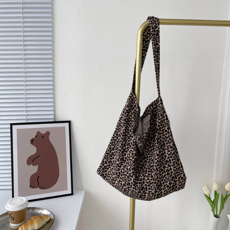 Diseño nicho bolsas de lona para mujeres 2025 nueva gran capacidad coreana estampado de leopardo flor de hombro impresa bolsas de mujer