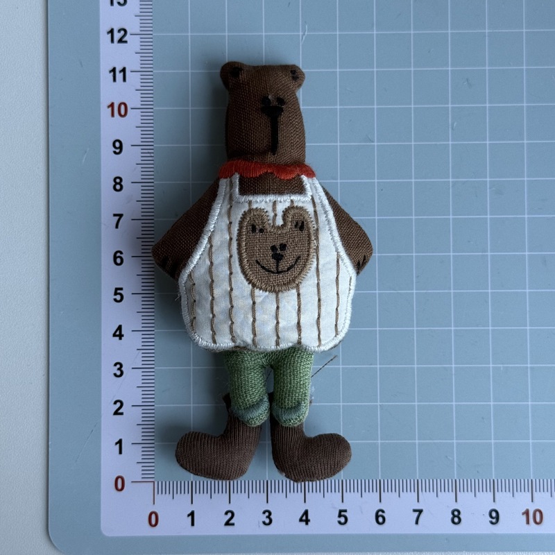 新しい布芸のかわいい蝶結びのマフラーの熊の包みのブローチの髪飾りは漫画のDIYの服装の補助材料を飾ります。|undefined