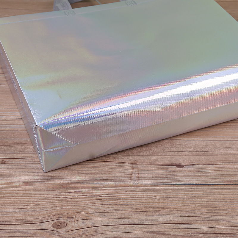 Fabricante spot engrosamiento colorido láser laminada ropa bolso no tejido compras bolsa de regalo de alta gama impresión logotipo