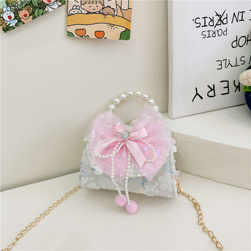 Nueva princesa de dibujos animados bolsos infantiles lindos bolsos de arco de moda chica perla bolsos de hombro