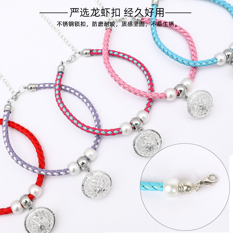 Collar de gato al por mayor campana de gato mascota joyería de metal hueco babero tejido collar de cuerda roja collar collar de gato