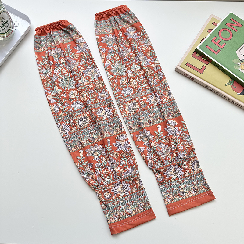 Mangas de protección solar para mujeres de verano nuevo estilo al aire libre anti-UV patrón de montar mangas de brazo de impresión de viento elegante