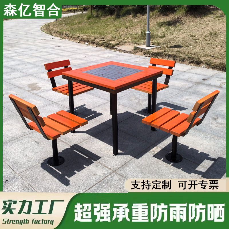 Mesas y sillas de tablero de ajedrez al aire libre Sillas de parque al aire libre de madera anticorrosiva Patio Una mesa Cuatro sillas Combinación Plaza comunitaria Ocio